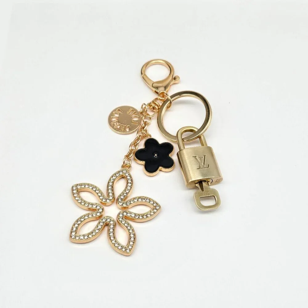 Louis Vuitton Gold-Tone Crystal Flower Keychain with Black Accent